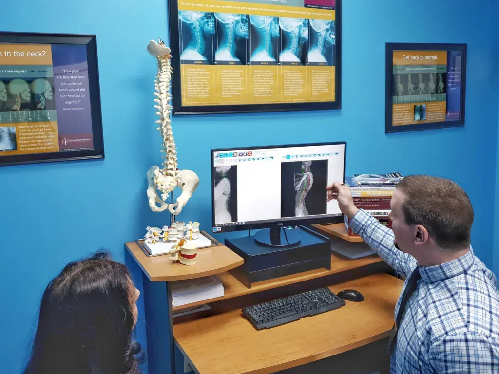 Dr. Koser discussing spine imaging in the clinic