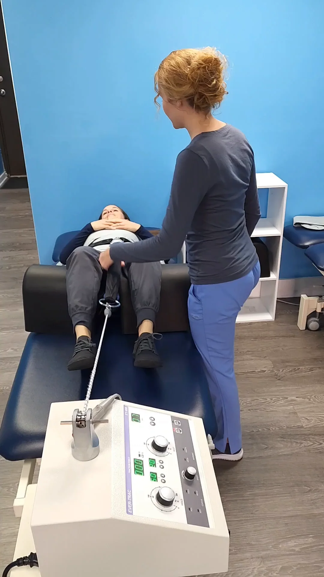The clinic decompression table, knee support and traction unit during a demonstration