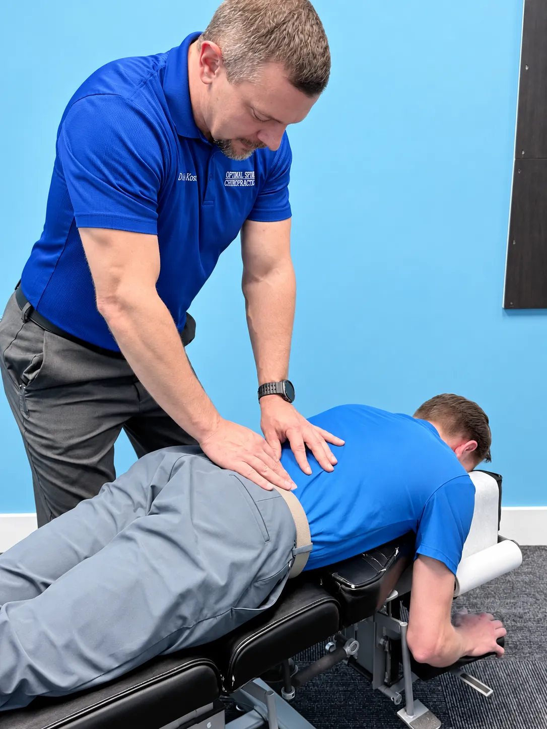 Dr. Koser providing hands-on care with a person lying face down on the treatment table