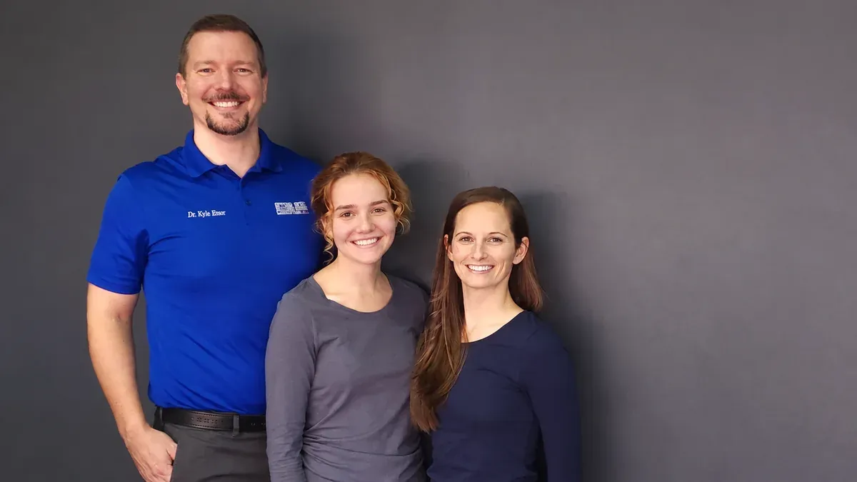 Dr. Koser with two clinic team members